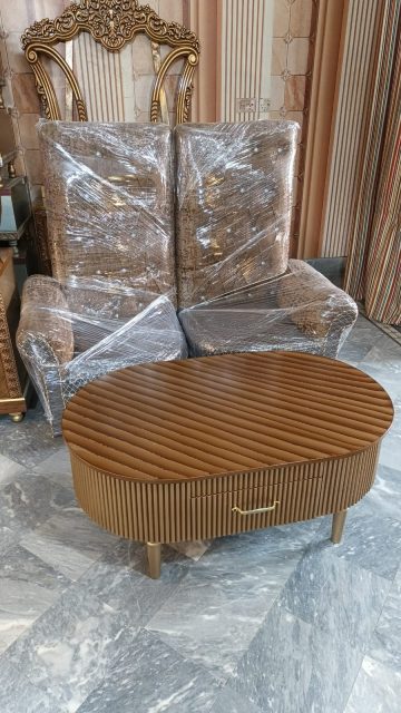Warm Brown Fluted Oval Coffee Table — main view from the supplied Priceless collection